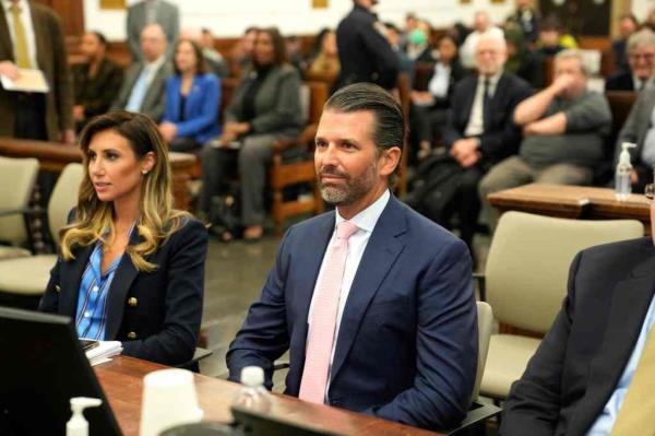 Do<em></em>nald Trump Jr. and lawyer Alina Habba are seated for the fraud trial.