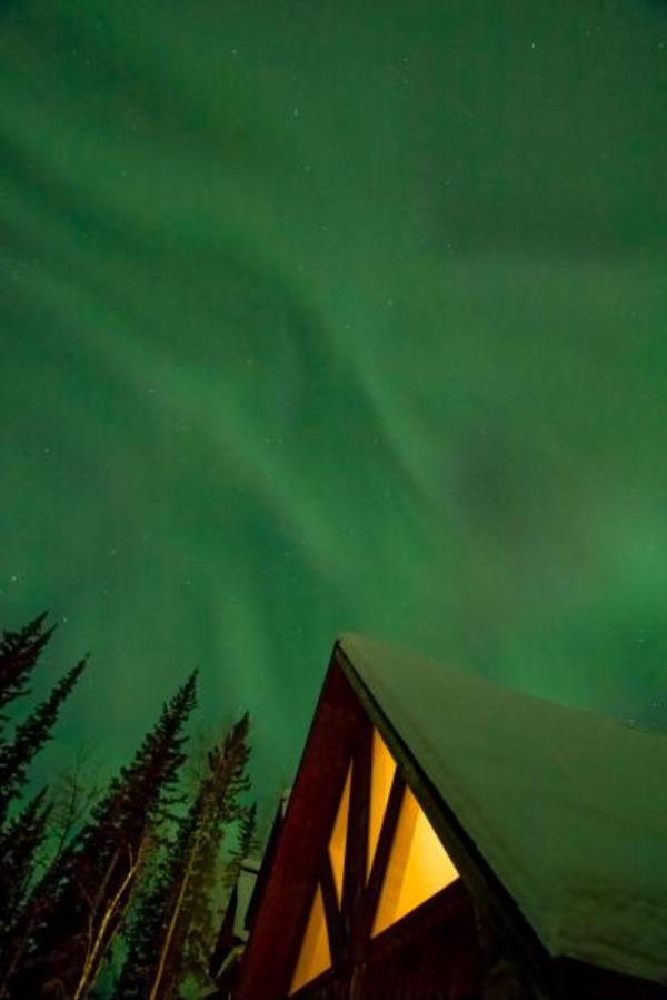 Northern lights over a house
