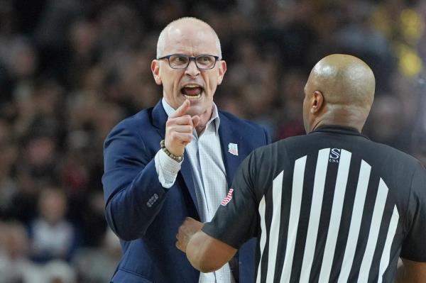 Co<em></em>nnecticut Huskies head coach Dan Hurley, in a suit, reacting to a referee's call during the first half of the 2024 NCAA Tournament Final Four Natio<em></em>nal Champio<em></em>nship game