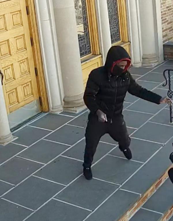 The attacker slugged the 68-year-old woman in the face on the steps of the Saint Demetrios Greek Orthodox Church, cops said.
