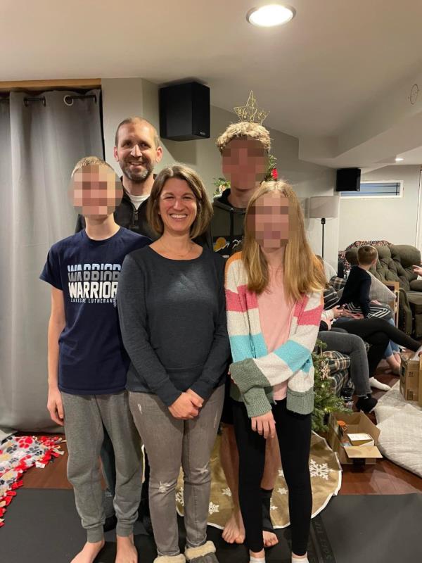 Ryan Borgwardt with his wife Emily and their children posing for a photo