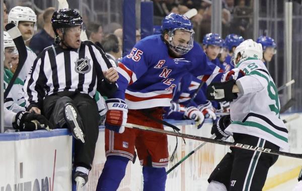 Ryan Lindgren, who played despite suffering a bruised cheek against the Islanders, is checked by Matt Duchene (right) during the Rangers' win over the Stars.