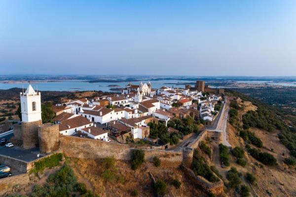Aerial view of historic village Mo<em></em>nsaraz in Alentejo, Portugal, with white buildings on a hill