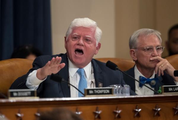 Rep. John Larson, D-Conn., joined at right by Rep. Earl Blumenauer, D-Ore., questions House Ways and Means Committee Chairman Kevin Brady, R-Texas, on Capitol Hill in Washington, Nov. 6, 2017.