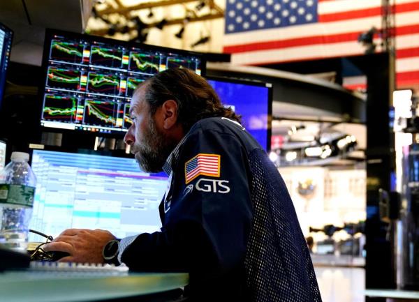 Traders work the floor of the New York Stock Exchange