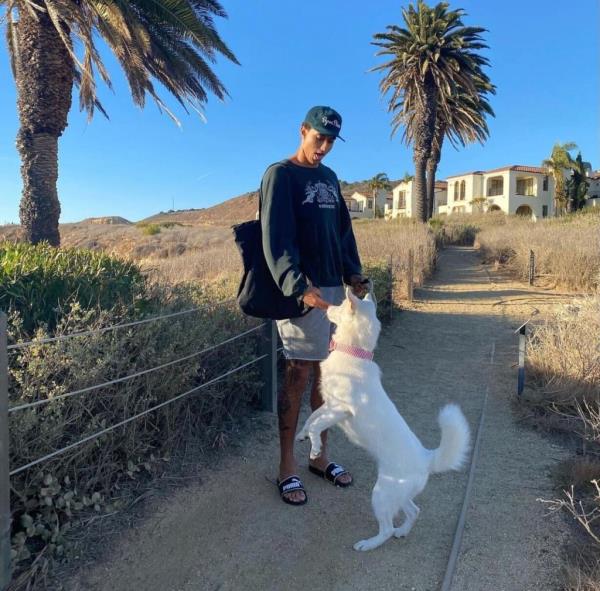 Kyle Kuzma with a dog in 2020. It's unclear if this is the dog involved in the alleged plane incident.
