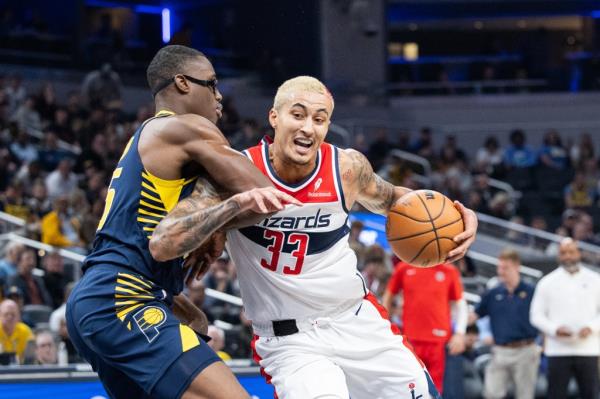 Wizards forward Kyle Kuzma (33) dribbles against the Pacers' Jalen Smith on Oct. 25, 2023.