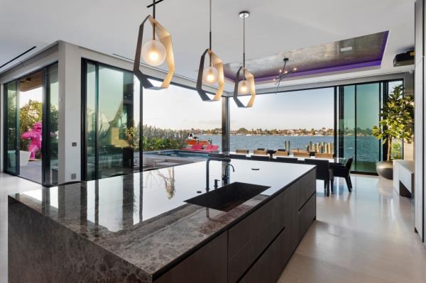 The open chef's kitchen/dining area is filled with light