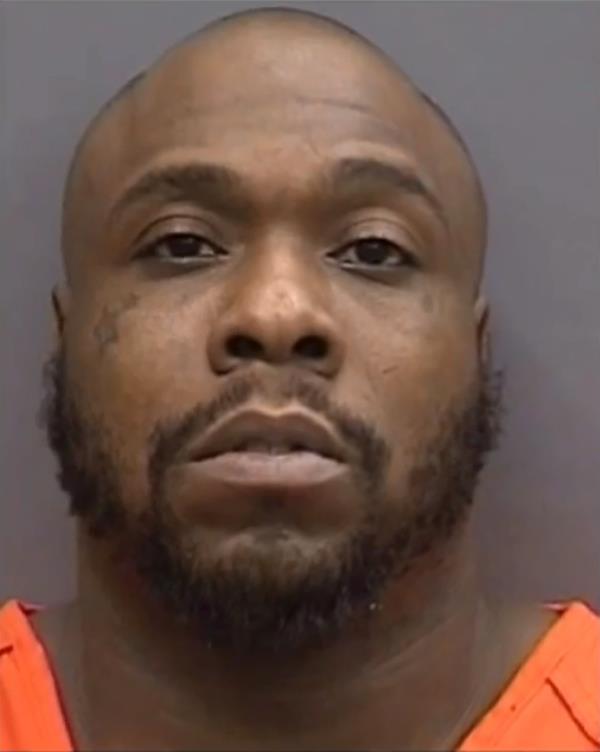 A man in an orange shirt, possibly Marcus Jenkins, co<em></em>nnected to a case a<em></em>bout a couple targeted by violent robbers in Tampa, Florida