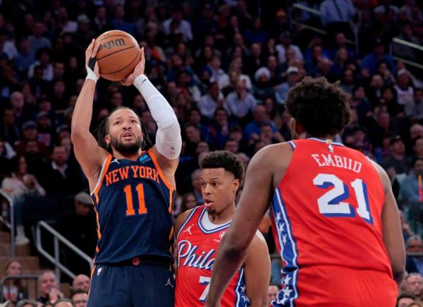 Jalen Brunson, who has struggled offensively this series, shoots a jumper round Kyle Lowry (right) and in front of Joel Embiid during the Knicks' Game 2 victory.