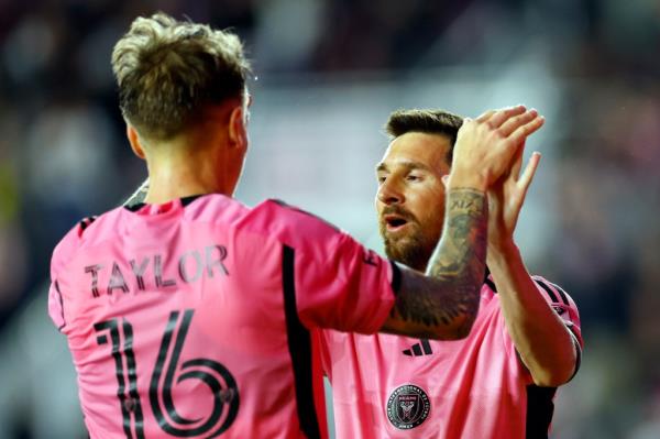 Lio<em></em>nel Messi #10 celebrates with Robert Taylor #16 of Inter Miami after Taylor's goal scored during the first half.