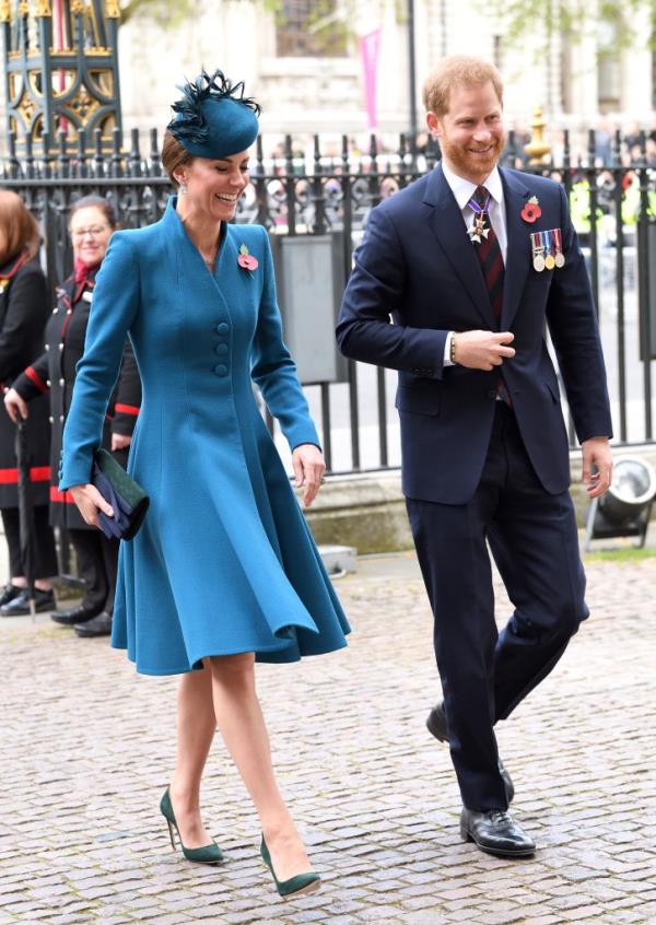 Photo of Kate Middleton walking with Prince Harry. 