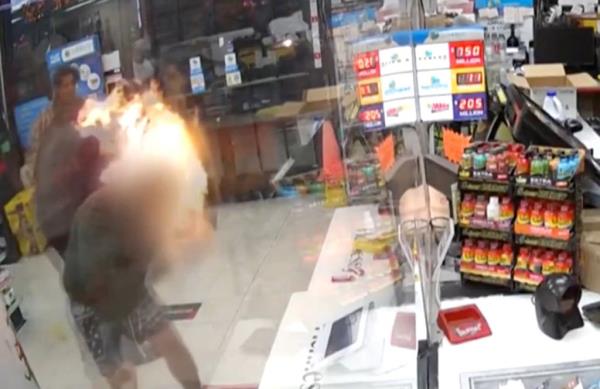 During the tussle, Kendall Burton pours lighter fluid on the clerks head and ignited it.