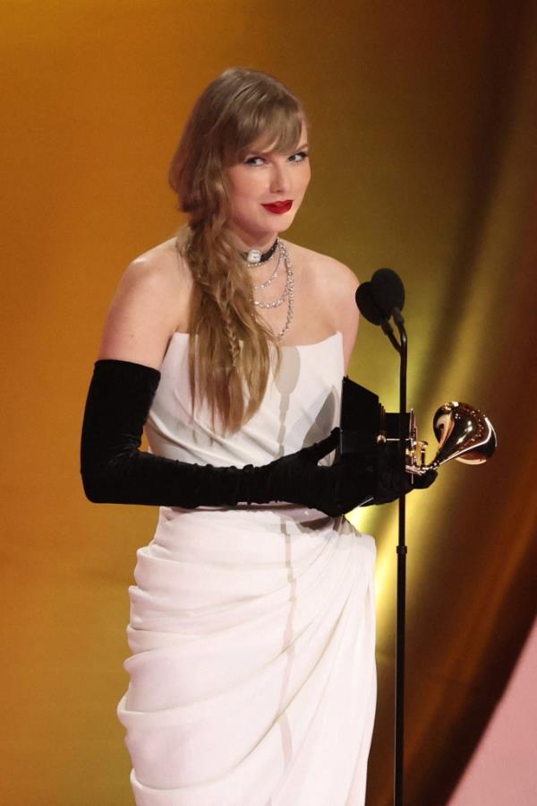 Taylor Swift accepts the award for Best Pop Vocal Album for Midnights during the 66th Annual Grammy Awards in Los Angeles, California