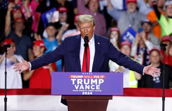 Former US President Do<em></em>nald Trump speaking at his campaign rally in Van Andel Arena, Grand Rapids, Michigan, November 5, 2024