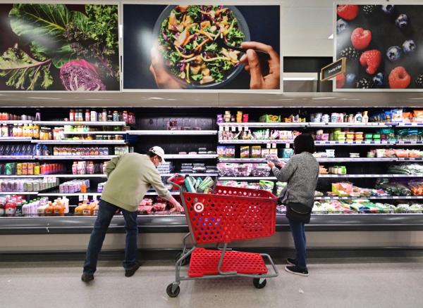 People shopping in the food section of a retail store in Rosemead, California, in 2024
