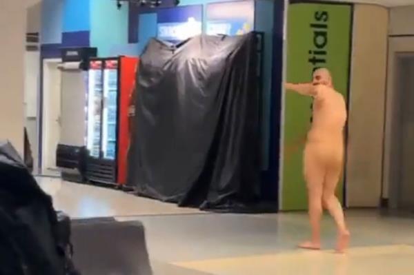 Video shows naked man proudly strolling through DFW airport.