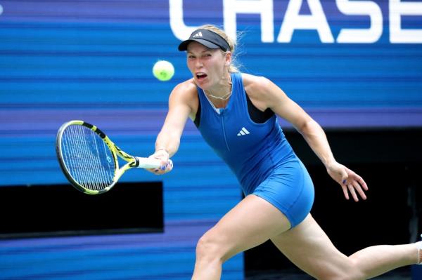 Caroline Wozniacki hits a return to Coco Gauff in the fourth round match of the U.S. Open.