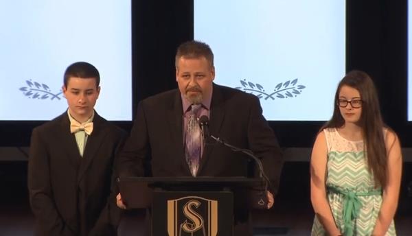 A teenaged Rhett Barlow, alo<em></em>ngside his father and sister and Michelle Barlow's memorial service following her death in 2016.