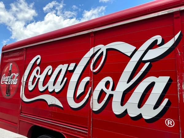 The Coca-Cola logo adorns the side of a delivery truck May 15, 2024, in southeast Denver.