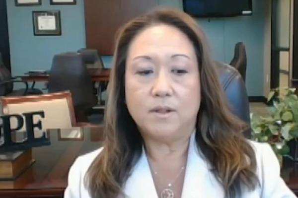 Poway Unified superintendent in white jacket placed on leave due to harassment accusations against high school softball team.