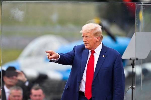 Former US President and Republican presidential candidate Do<em></em>nald Trump points after speaking a<em></em>bout natio<em></em>nal security during a campaign rally at the North Carolina Aviation Museum & Hall of Fame in Asheboro, North Carolina, August 21, 2024.