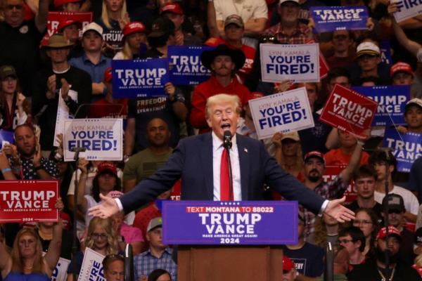 Do<em></em>nald Trump speaking at a podium during a campaign rally in Bozeman, Mo<em></em>ntana with a crowd of people, August 9, 2024