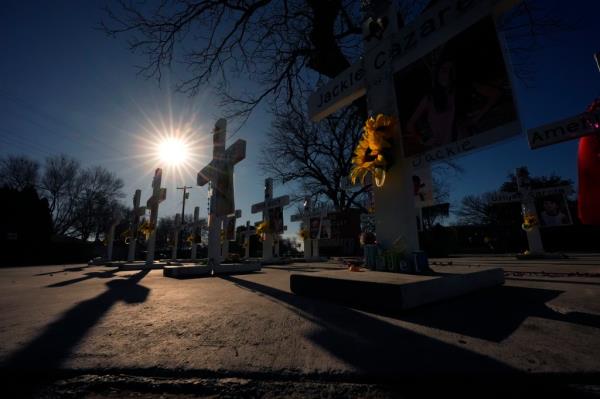 Crosses stand in memorial to victims of the school shooting at Robb Elementary, 