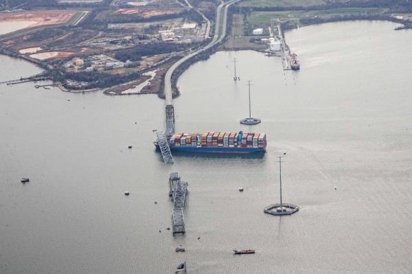 The co<em></em>ntainer ship Dali is shown amidst the wreckage of the collapsed Francis Scott Key Bridge in Baltimore, Tuesday, March 26, 2024.