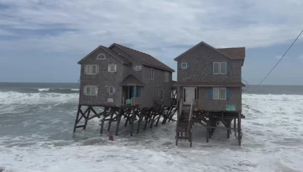 Erosion, exacerbated by climate change, caused the homes to collapse.