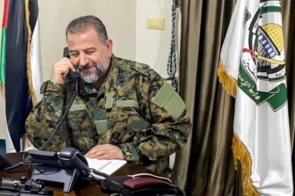 Hamas' deputy chief Saleh al-Aruri is seen above speaking on a phone at an office in Beirut before he was killed.</p>

<p>　　