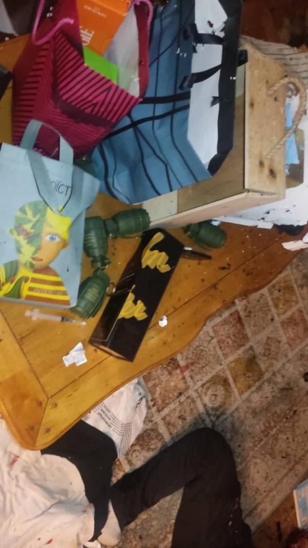 A photo shows gift bags on the ground with grenade-shaped objects on the ground.