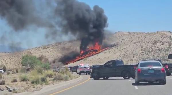 plane burning in a field