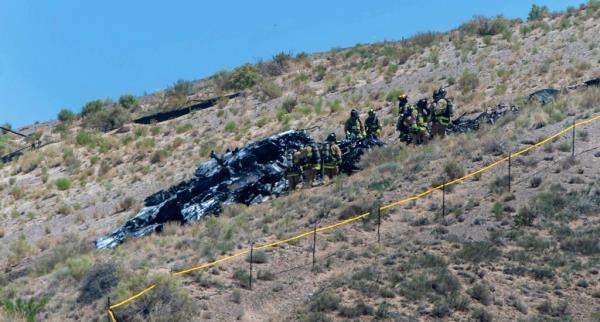 Emergency workers respond to a military plane crash near the Albuquerque Internatio<em></em>nal Airport,