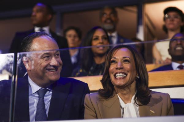 Second gentleman Doug Emhoff and Democratic presidential nominee Vice President Kamala Harris listen during speeches at the Democratic Natio<em></em>nal Convention.