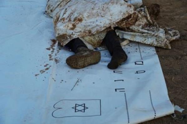 The body of one of the Hamas militiamen who attacked Kibbutz Be'eri on October 7.