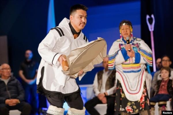 A drummer dances during the Nunavut devolution agreement ceremony at the Aqsarniit Hotel & Co<em></em>nference Centre in Iqaluit, Nunavut, Canada, Jan. 18, 2024.