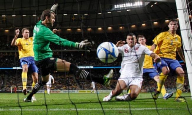 Steven Caulker scores past Andreas Isaksson during the internatio<em></em>nal friendly match between Sweden and England at the Friends Arena in 2012