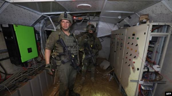 This photo, taken during a Feb. 8, 2024, media tour organized by the Israeli military, shows Israeli soldiers inside a tunnel that the army claims is a 