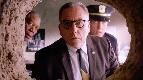 Warden Norton looking in a hole in the Shawshank Redemption