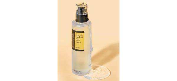 COSRX Snail Mucin on peach background