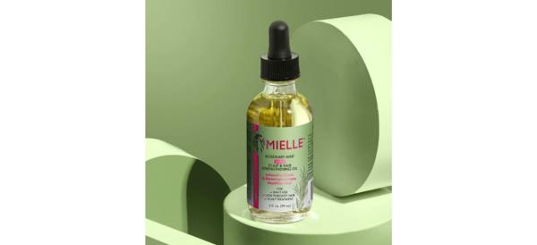 Mielle Organics Rosemary Mint Light Scalp & Hair Strengthening Oil on mint green background